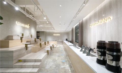 Minimalist Harlan+Holden café interior with stepped seating and long counter