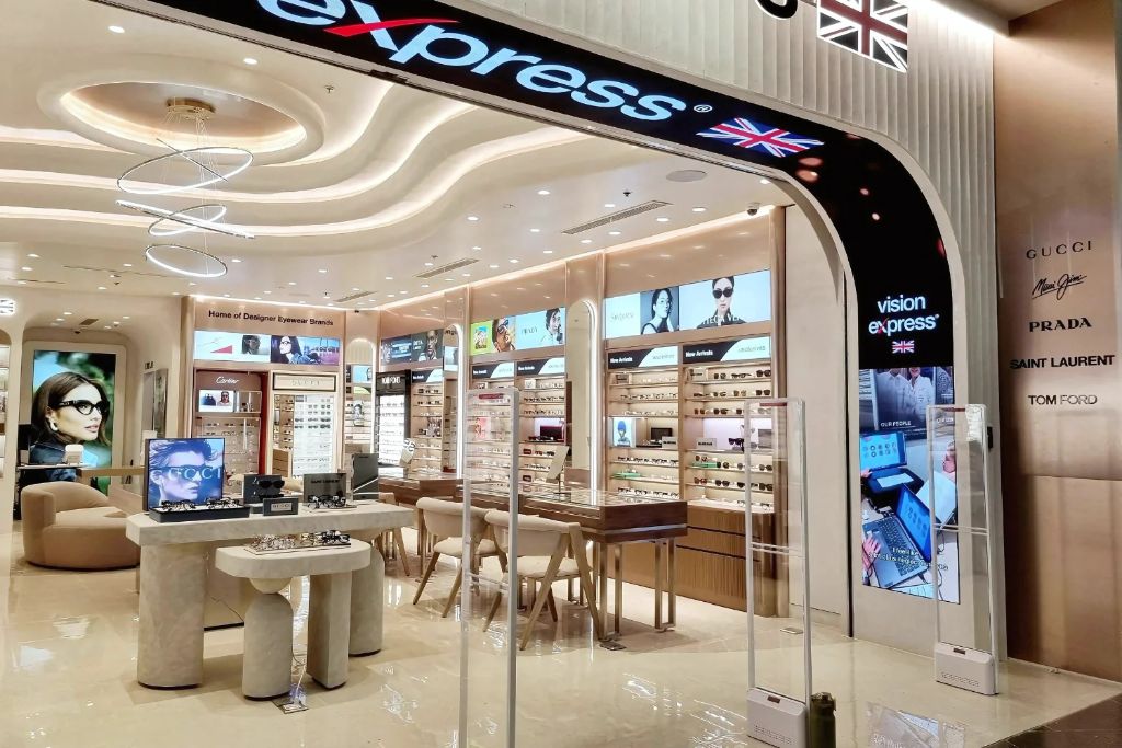 Vision Express storefront with illuminated designer eyewear displays